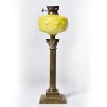 Victorian oil lamp base with glass reservoir on brass Corinthian column, 56cm high Provenance: