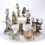 Porcelain centrepiece in the form of a candelabra, 33cm, eight other porcelain figures and a