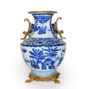 Large blue and white porcelain vase Chinese, with gilt metal mounts, scenes depicting figures in a