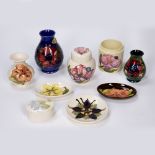 Collection of Moorcroft pottery to include vases, pin dishes, pot and cover etc, all with