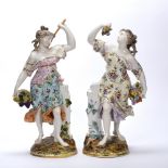 Pair of porcelain models of fruit gatherers Samson, each on a circular base, 38cm high