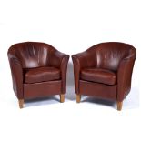 Pair of contemporary leather tub chairs on oak supports, 64cm across, 67cm high Provenance: Long