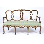 Parcel gilt and walnut settee Italian, 18th Century, with later upholstered seat, carved chair