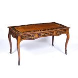 Walnut library/writing table French, 19th Century, of serpentine form with marquetry foliate
