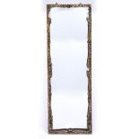 Early 20th Century French style overmantel mirror with gilt painted scrolling frame, 127cm x 40cm