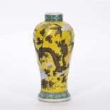 Canton baluster vase late 19th/early 20th Century, decorated with a dragon amongst foliage on yellow