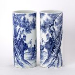 Pair of blue and white porcelain sleeve vases Chinese each painted with a lohan and boy carrying a