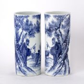 Pair of blue and white porcelain sleeve vases Chinese each painted with a lohan and boy carrying a