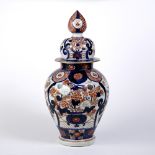 Imari vase and cover Japanese decorated with panels of birds, the lid with an elongated finial, 45cm
