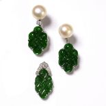Jadeite pendant Chinese with white metal backing, together a pair of jadeite earrings with carved
