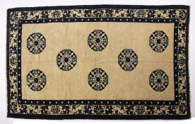 Peking rug Chinese circa 1920 with eight blue roundels on an ivory ground, 212cm x 129cm