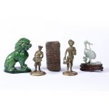 Group of pieces Chinese comprising a green glazed lion dog, a boxwood carved seal, a jade crane on