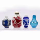 Four glass snuff bottles Chinese, 19th/20th Century comprising a red overlay decorated snuff