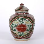 Polychrome jar and cover Chinese, Ming period painted with iron-red lotus, each in a panel, 15cm