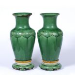 Pair of green glazed vases and stands Chinese, 18th/19th Century decorated to the neck with a ruyi