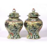 Pair of baluster lidded vases Chinese, 19th Century decorated to the body in famille verte