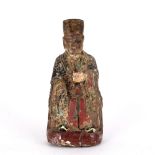 Wooden seated lohan figure Chinese, late 17th Century traces of original and later painting, 30cm