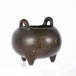 Bronze censer Chinese, 19th Century of rounded form with twin handles, Xuande seal mark, 12cm across