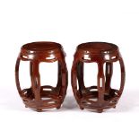 Pair of hardwood barrel shaped stools Chinese, 20th Century the circular tops with beaded border,