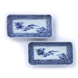 Pair of blue and white oblong dishes Japanese, 19th Century painted to the centre with flowers