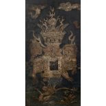 Framed panel Chinese, 19th Century painted with a ceremonial temple dog amongst Buddhist symbols,