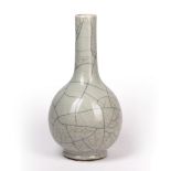 Guan type bottle vase Chinese, 19th Century covered in a pale glaze, with a fluted neck, 37.5cm