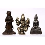 Three cast metal models of deities Tibetan, 19th Century comprising of a standing figure with the