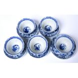 Five blue and white tea bowls Chinese, 18th Century decorated with repeating panels of figures and
