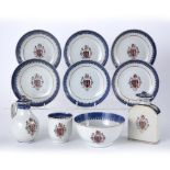 Group of Armorial export porcelain Chinese, circa 1800 including a tea caddy, cream jug, cup, slop