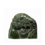 Spinach jade carving Chinese depicting a mountain and pine tree with scholar beneath, 12.5cm across,