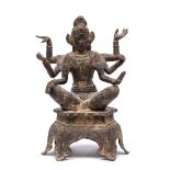 Cast metal model of a deity Tibetan with six arms in various poses, on a raised base, 23.5cm high