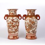 Pair of Kutani vases Japanese decorated with birds on a flowering tree, with animal head handles,