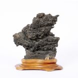 Scholar's rock Chinese on a later oval wood base, with Spink label, rock 25cm high