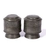 Pair of Paktong containers Chinese each of stepped cylindrical form, with engraved butterflies,