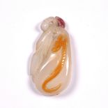 Semi-translucent agate pendant Chinese, 19th Century carved as a pear shaped fruit with leaves