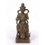 Gilt bronze standing figure of King Dhanada Tibetan 18th/19th Century dressed in flowing robes