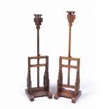 Pair of full height candle stands Chinese with adjustable columns , each on a carved base, .from
