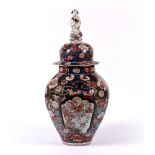 Imari vase and cover Japanese, 18th Century finial in the form of a figure holding a fan and with