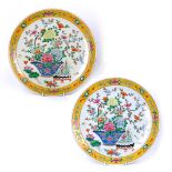 Pair of porcelain chargers Japanese decorated in polychrome enamels with baskets of flowering peony,