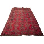 Large red ground Ushak carpet Turkish with traditional rows of geometric designs in blues and