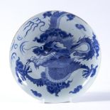 Blue and white porcelain saucer shaped bowl Chinese decorated in the Kangxi style, depicting a