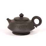 Yixing teapot Chinese with engraved calligraphy to the sides, and impressed seal mark to base, 7.5cm