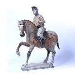 Ceramic horse and rider Chinese, Tang Dynasty, 618-906 AD the horse advancing with one foreleg
