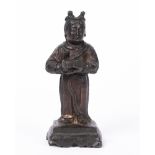 Bronze model of a Daoist priest Chinese, late 17th Century the figure holding a casket, the cast