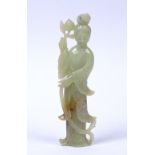 Jade figure of Guanyin Chinese, 19th/early 20th Century the standing figure holding a peach in her