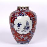 Fukagawa red ground vase Japanese, early 20th Century with panels of children playing within a