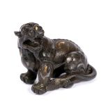 Bronze paperweight Chinese, 16th Century cast as a beast in a recumbent pose, with his head turned
