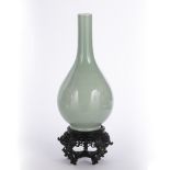 Monochrome bottle vase Chinese, 19th Century of celadon colour, the ovoid body tapering towards