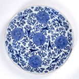 Large blue and white charger Chinese, Kangxi (1662-1722) painted with lotus flowers and trailing