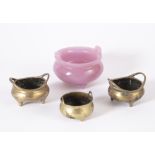 Pink glass censer Chinese supported by three squat feet, the base with a six character mark, 8.5cm
